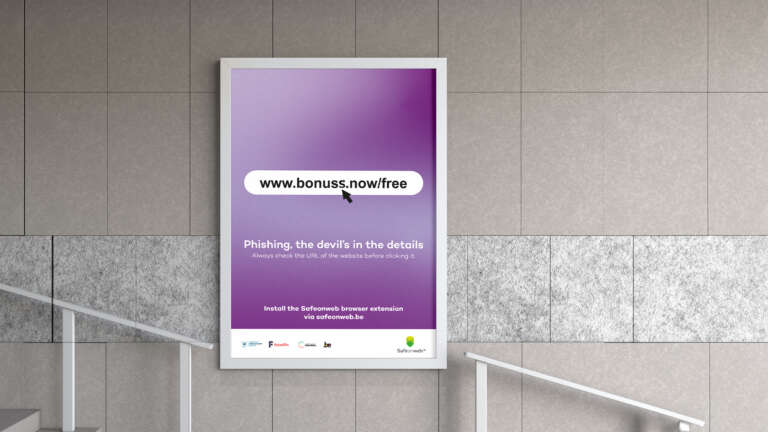 Poster in a station displaying a fake phishing URL on a purple background, raising awareness about online scams.